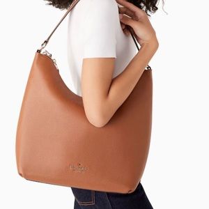 Kate Spade Zippy Shoulder Bag
COLOR:
Warm Gingerbread